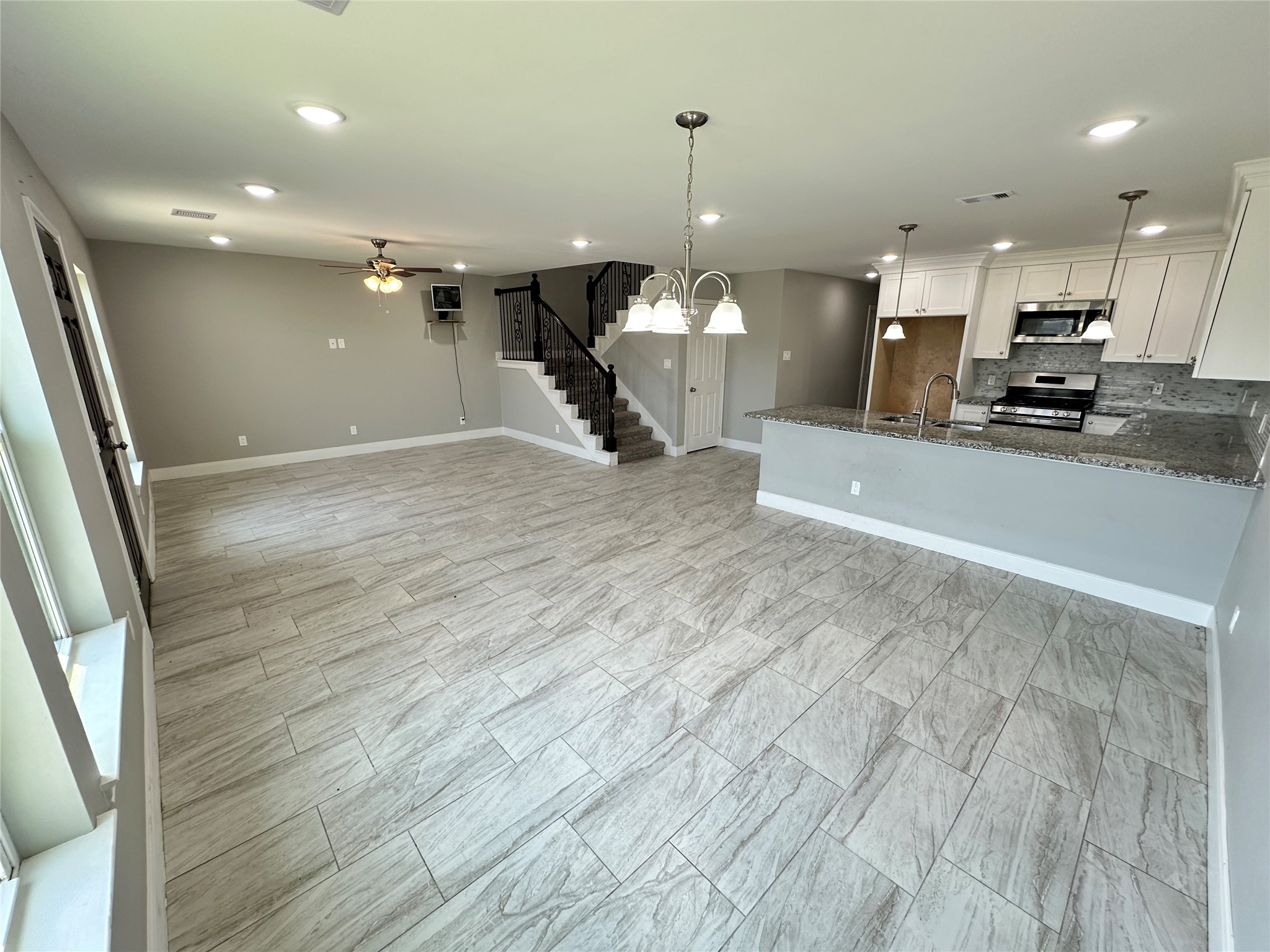 12703 West Hardy Road Houston, TX 77037 - Photo 7 of 29 a large room with kitchen view and living room view