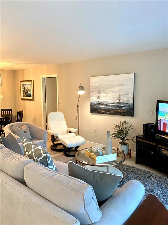 1667 Brookhouse Circle, Unit BR128 Sarasota, FL 34231 - Photo 20 of 38 a living room with furniture