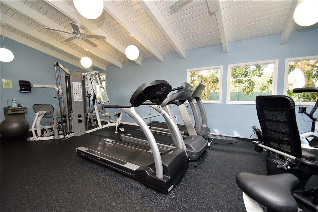 1667 Brookhouse Circle, Unit BR128 Sarasota, FL 34231 - Photo 22 of 38 a view of a room with gym equipment