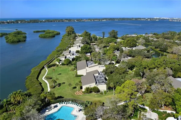 aerial view of a house with a lake view