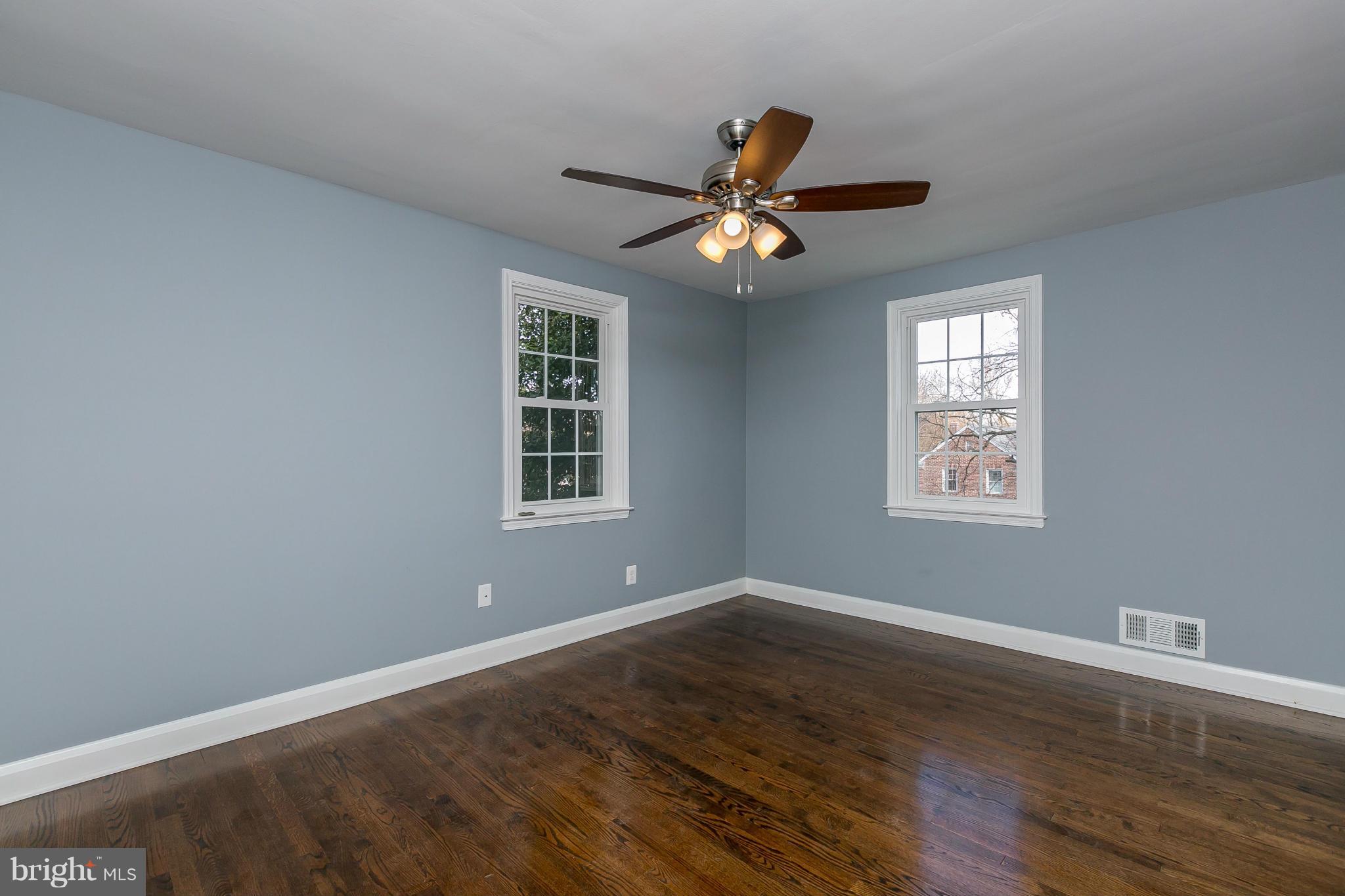 7126 Heathfield Road Baltimore, MD 21212 - Photo 8 of 23 a view of a room with wooden floor and windows