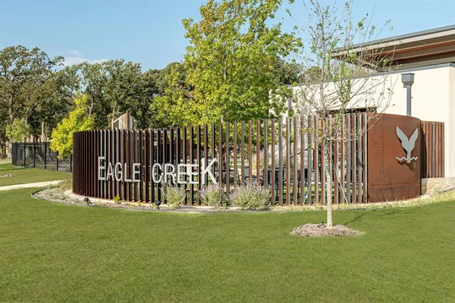 a view of a park with iron fence