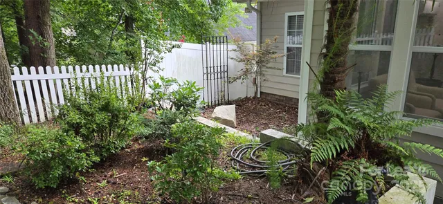 a backyard of a house with a garden