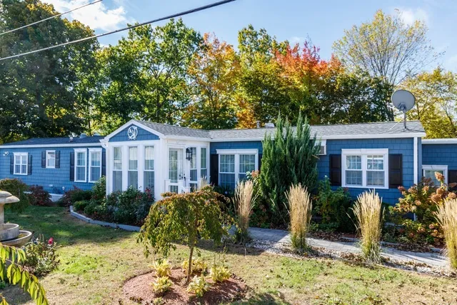 a front view of a house with garden