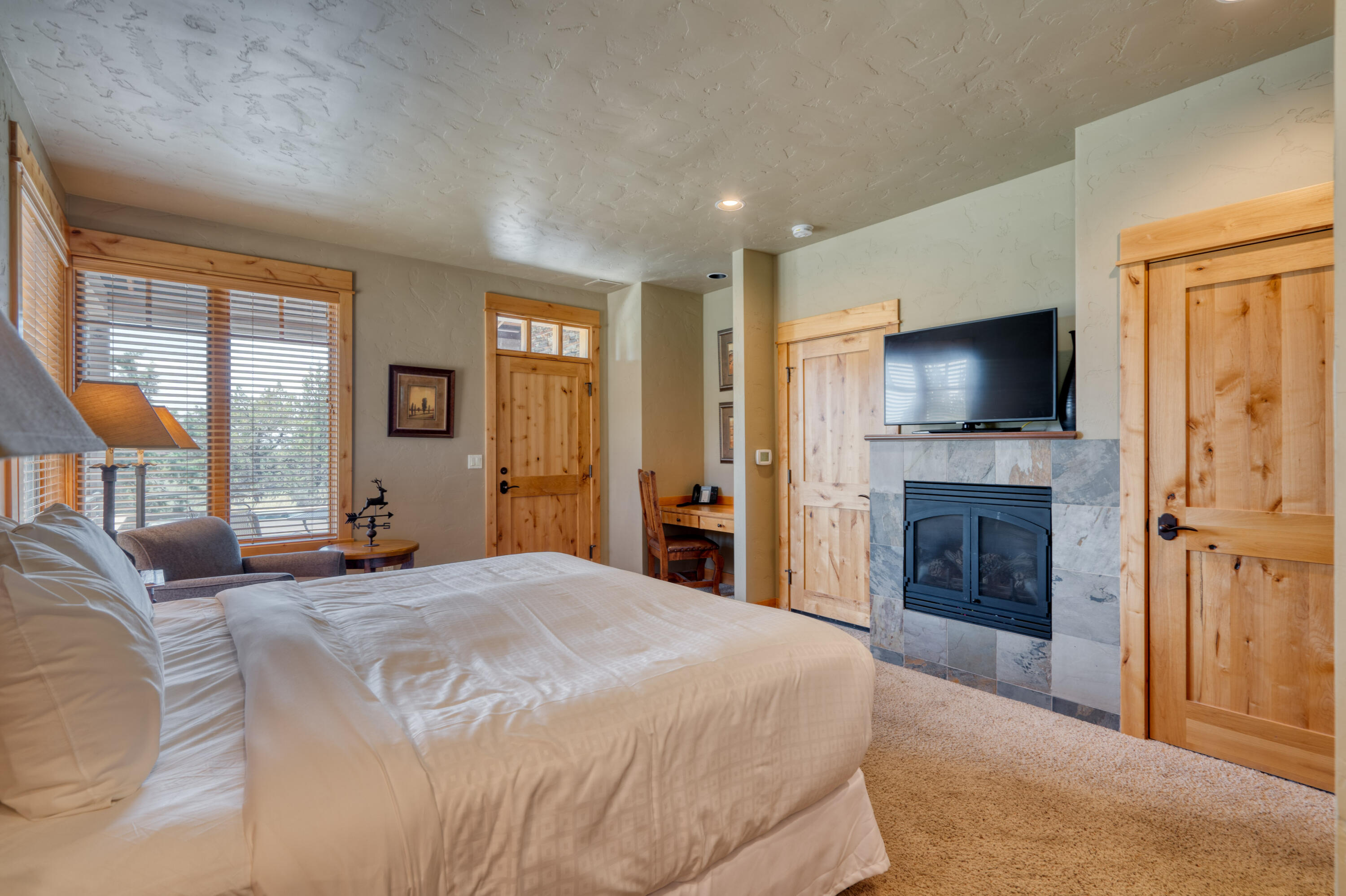 16727 South W Brasada Ranch Road Powell Butte, OR 97753 - Photo 13 of 31 Large suite with fireplace & deck access