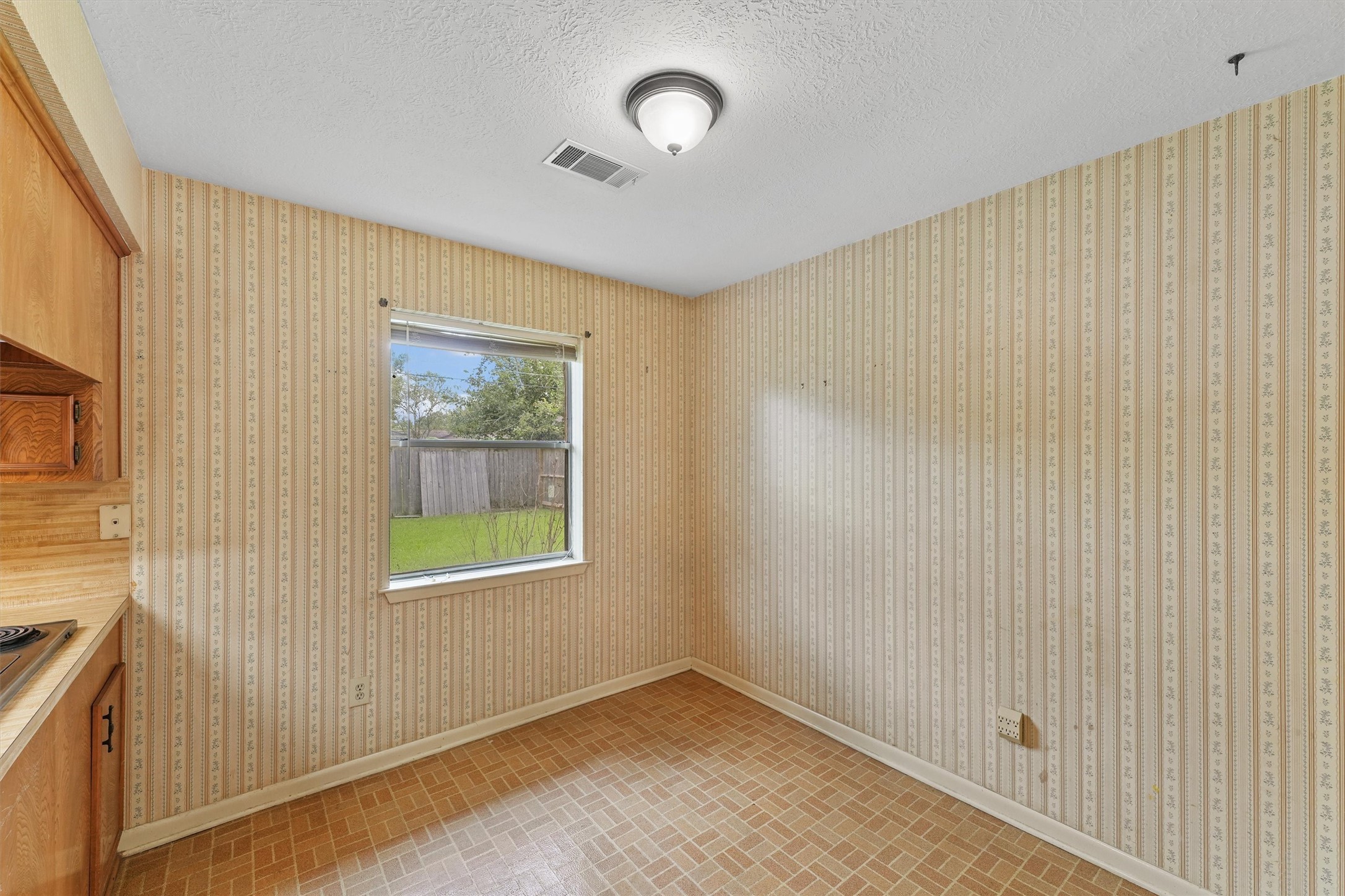 5103 Forest Trail Baytown, TX 77521 - Photo 12 of 25 a view of an empty room with a window
