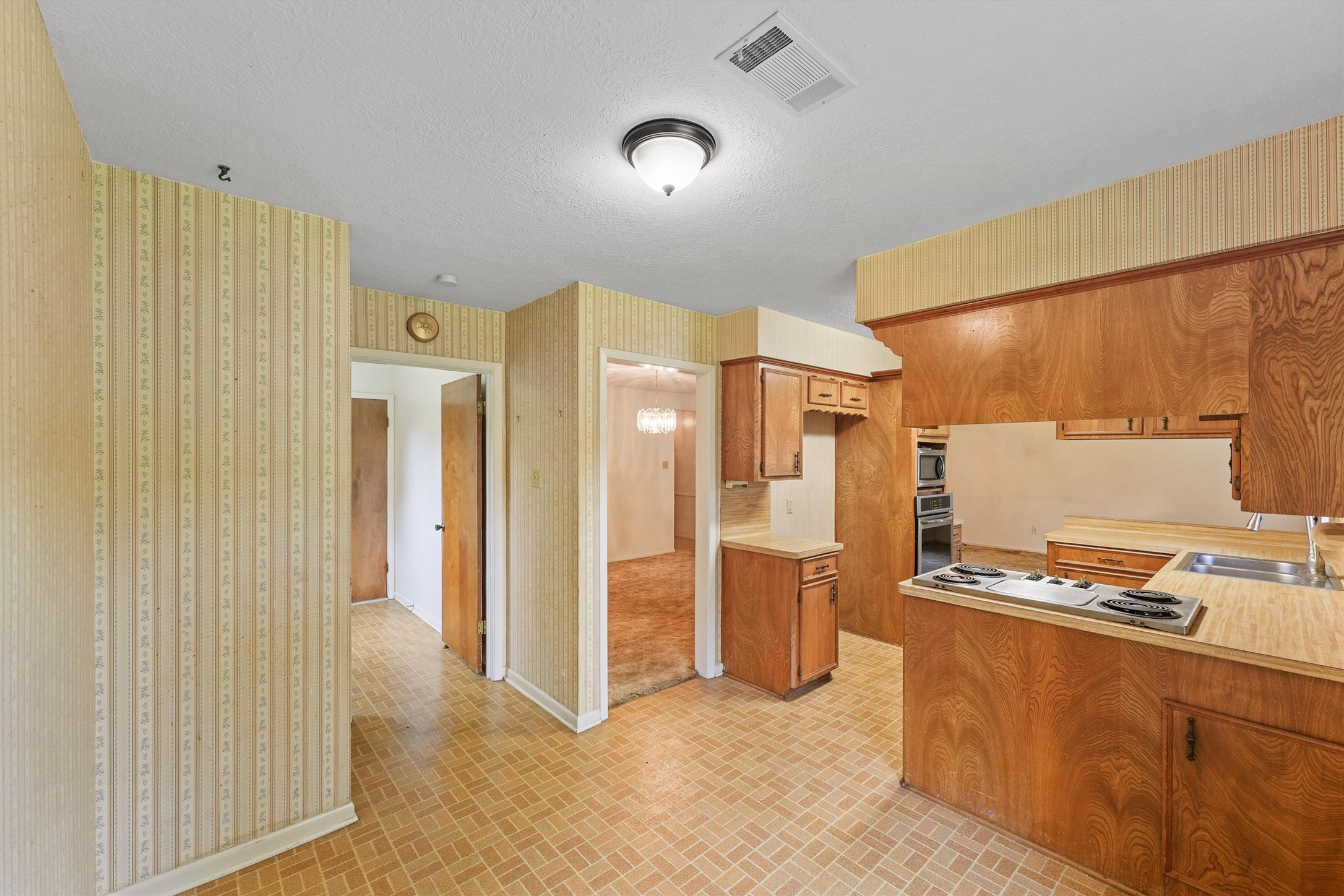 5103 Forest Trail Baytown, TX 77521 - Photo 13 of 25 a view of kitchen with stainless steel appliances refrigerator and stove