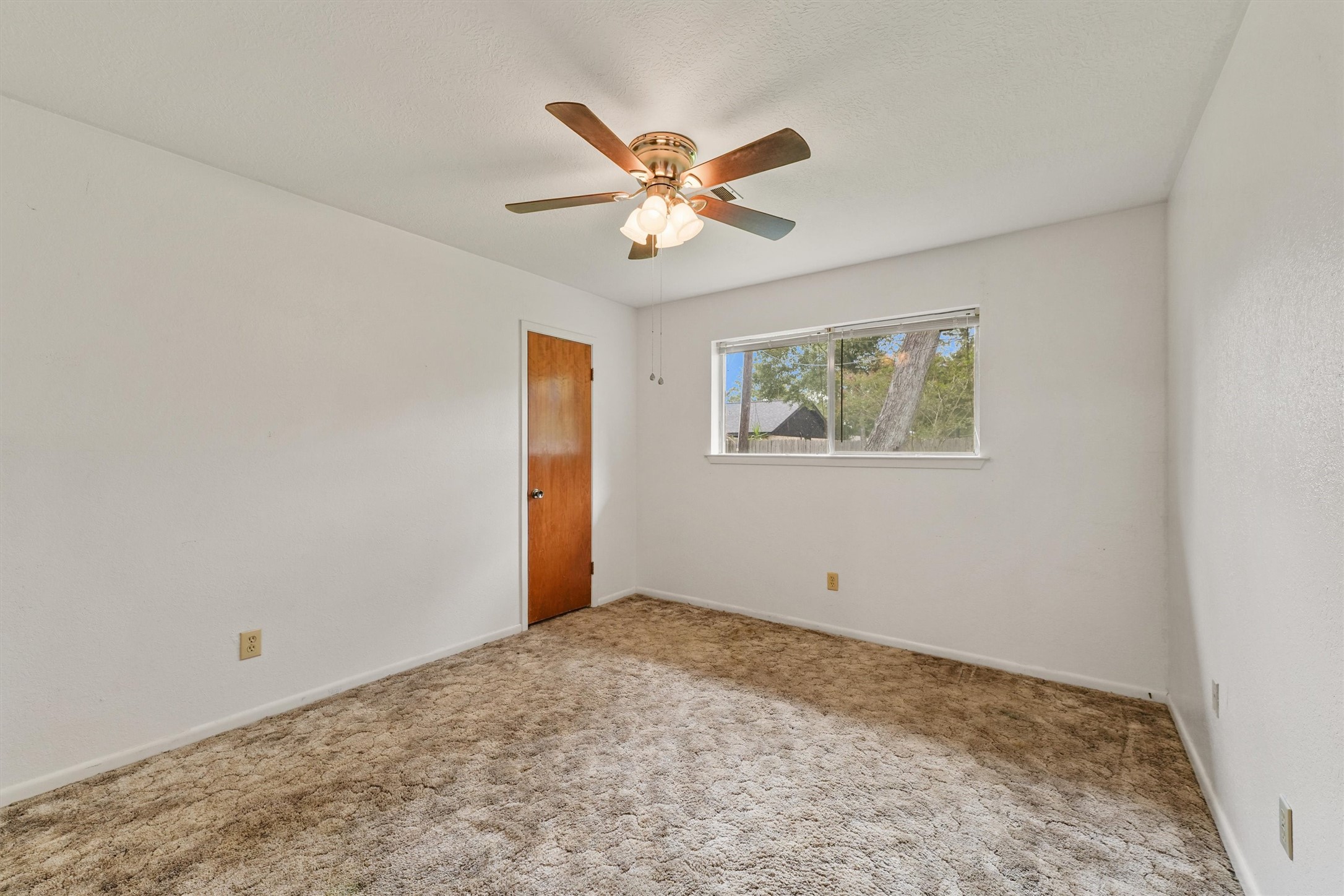 5103 Forest Trail Baytown, TX 77521 - Photo 15 of 25 a view of a livingroom with a ceiling fan and window