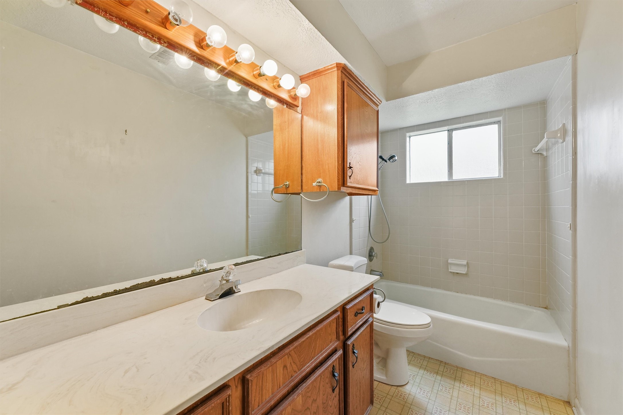 5103 Forest Trail Baytown, TX 77521 - Photo 17 of 25 a bathroom with a sink a toilet and shower