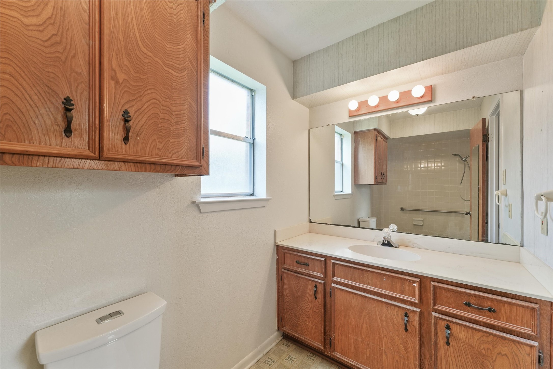 5103 Forest Trail Baytown, TX 77521 - Photo 20 of 25 a bathroom with a sink and a mirror