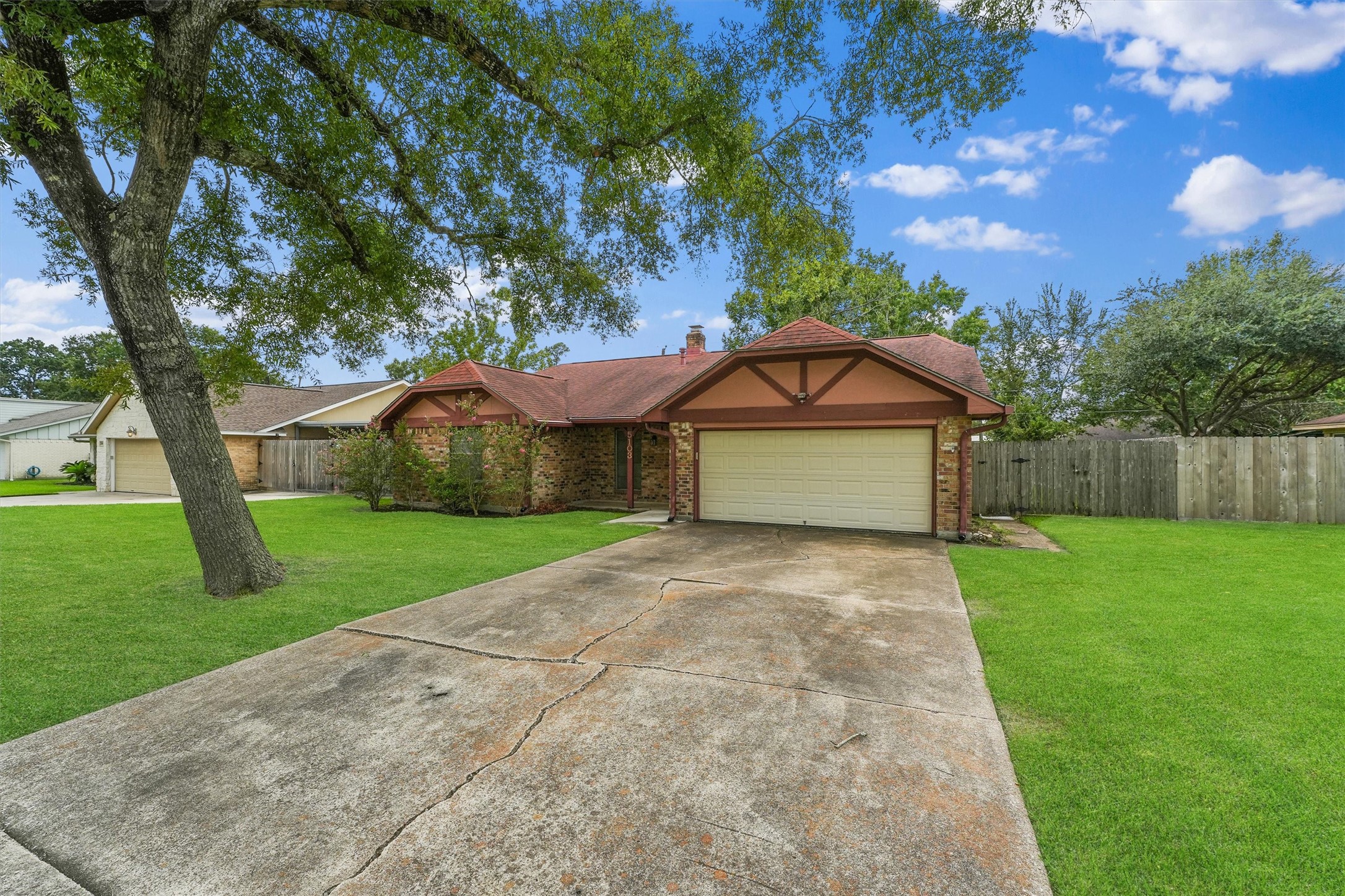 5103 Forest Trail Baytown, TX 77521 - Photo 2 of 25 a front view of house with yard and green space