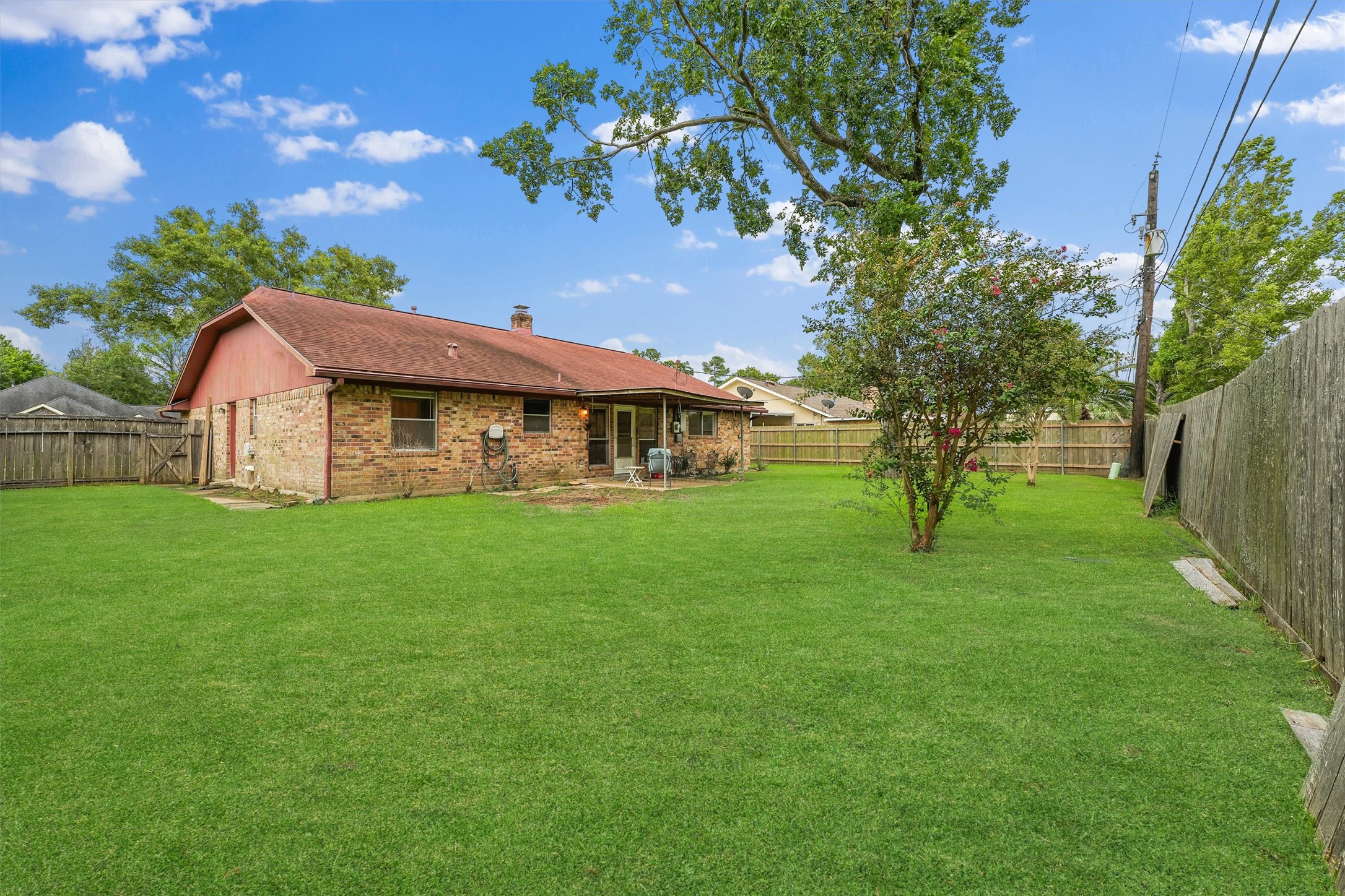 5103 Forest Trail Baytown, TX 77521 - Photo 23 of 25 a front view of house with yard and green space