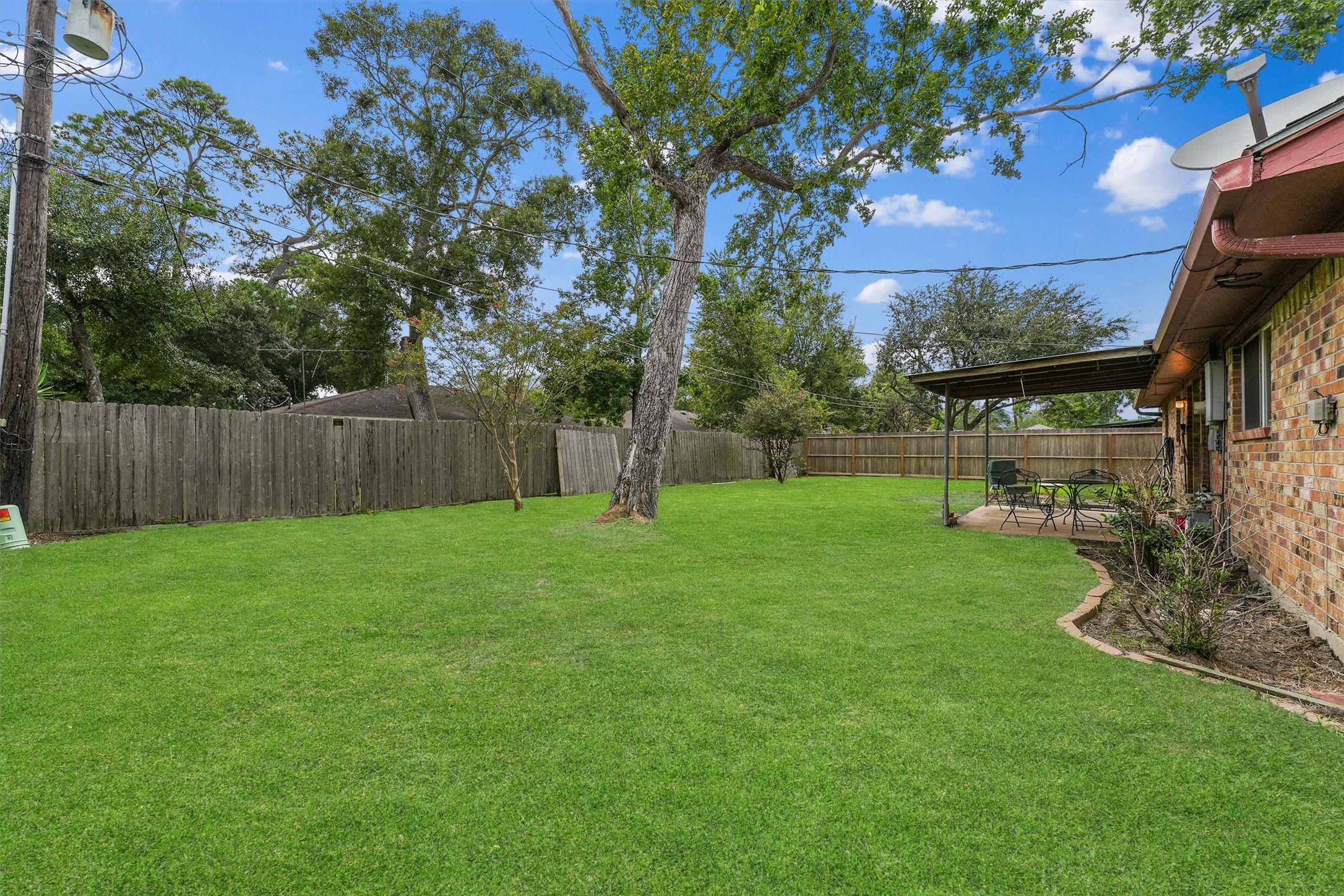 5103 Forest Trail Baytown, TX 77521 - Photo 24 of 25 a view of a backyard with a garden