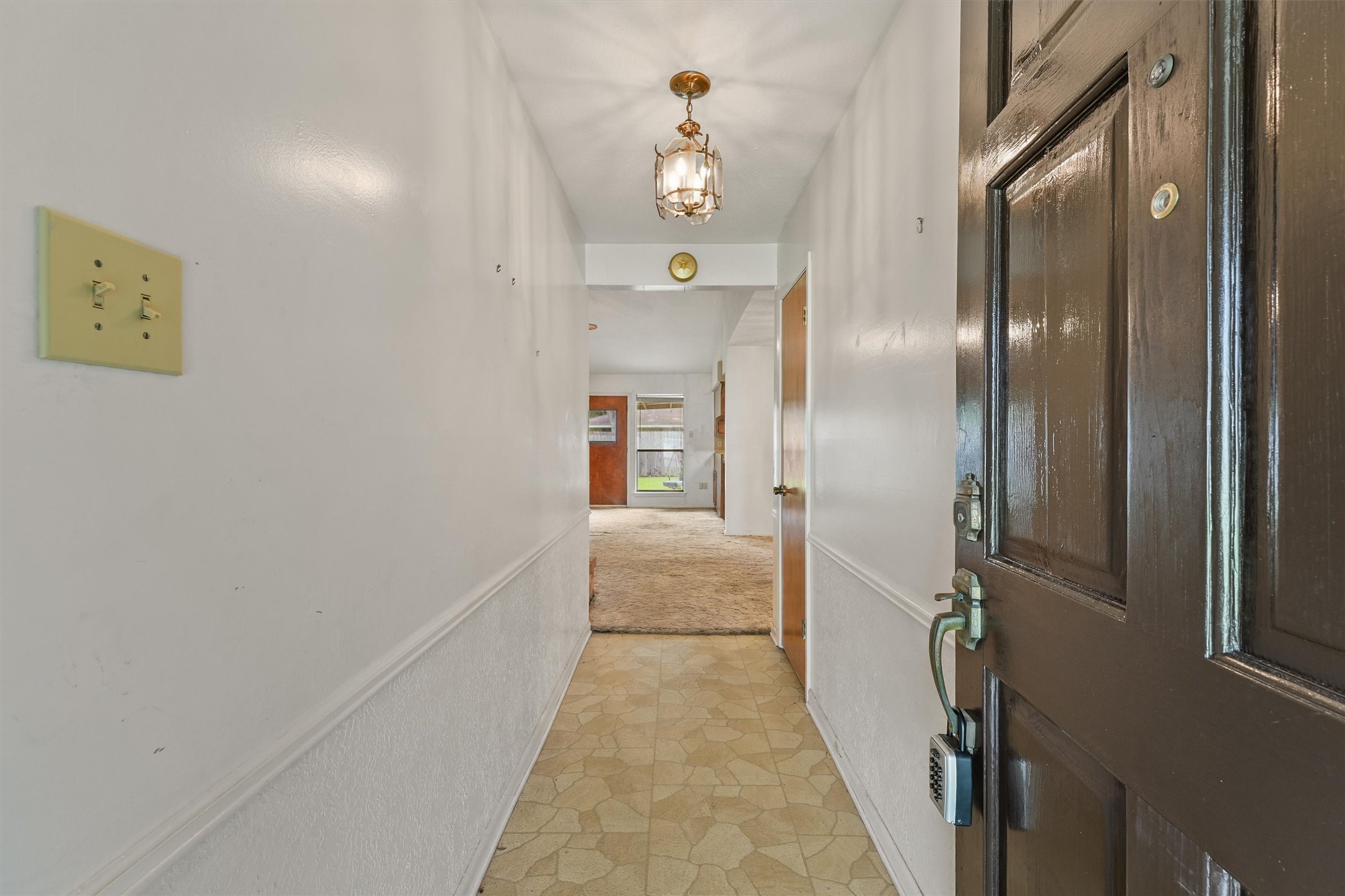 5103 Forest Trail Baytown, TX 77521 - Photo 4 of 25 a hallway with sliding door and stairs
