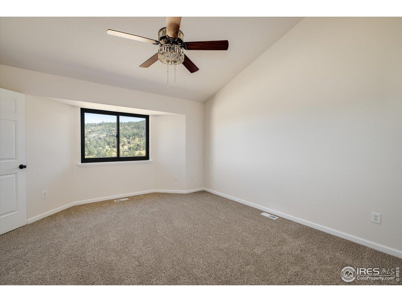 147 Makah Lane Lyons, CO 80540 - Photo 11 of 39 a view of an empty room with a window