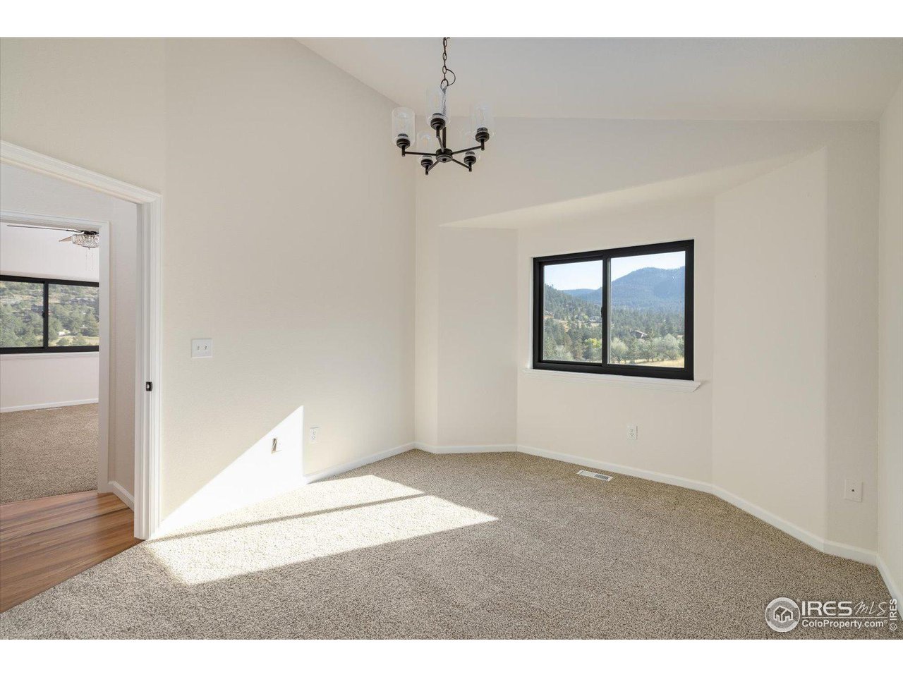 147 Makah Lane Lyons, CO 80540 - Photo 15 of 39 an empty room with windows and entrance