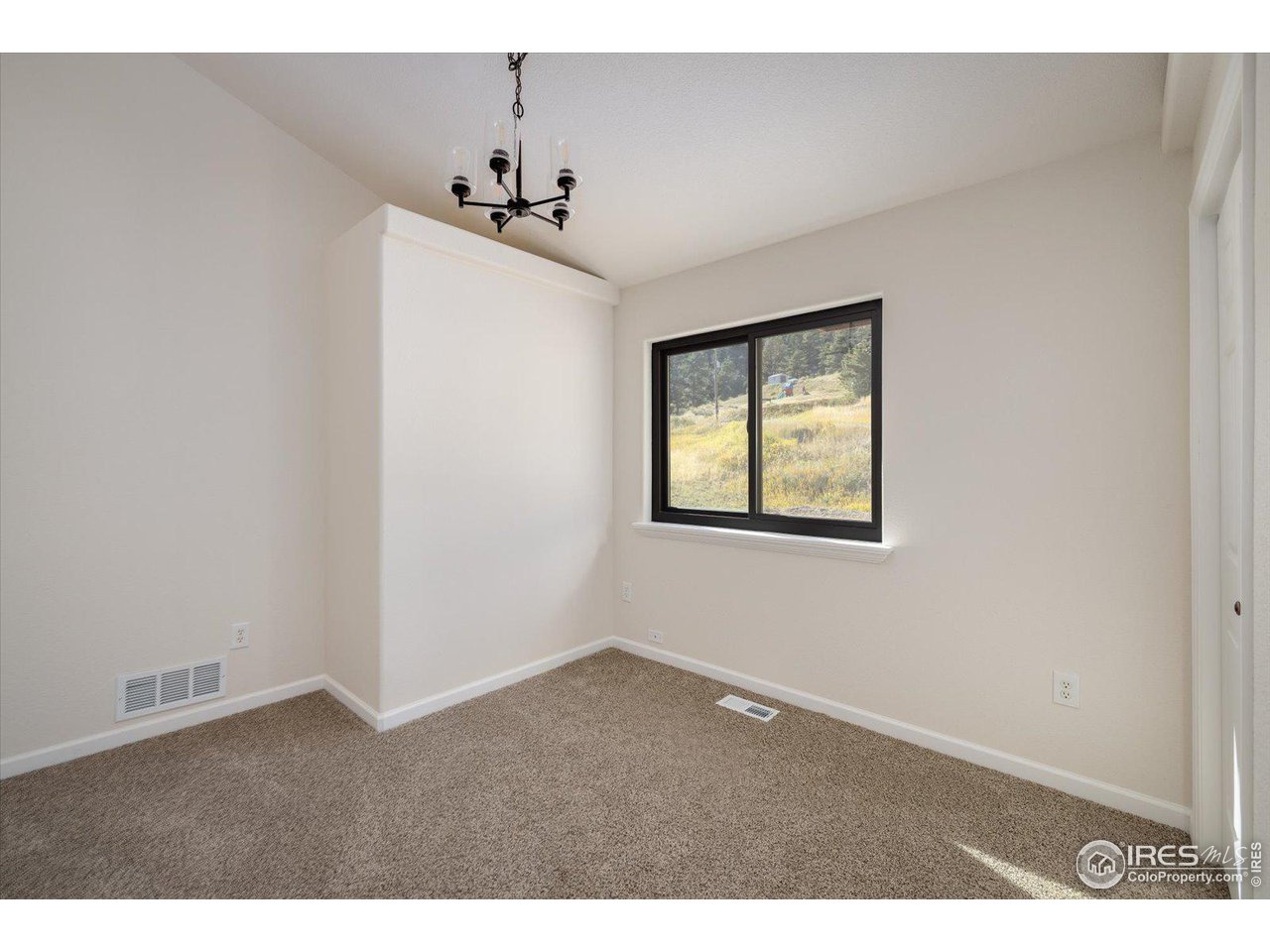 147 Makah Lane Lyons, CO 80540 - Photo 16 of 39 an empty room with windows