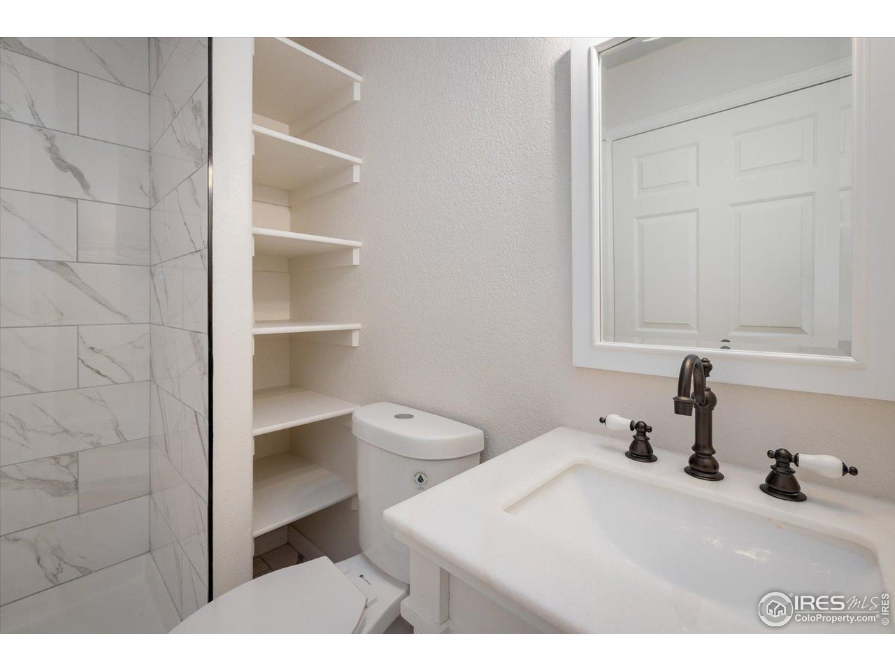 147 Makah Lane Lyons, CO 80540 - Photo 17 of 39 a bathroom with a sink and a toilet