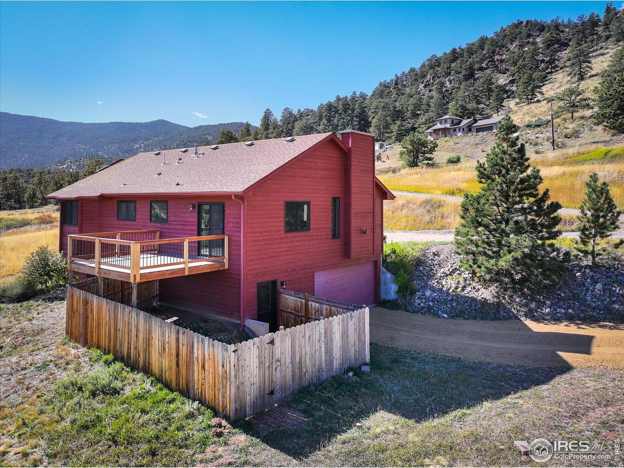147 Makah Lane Lyons, CO 80540 - Photo 21 of 39 a view of a house with wooden fence