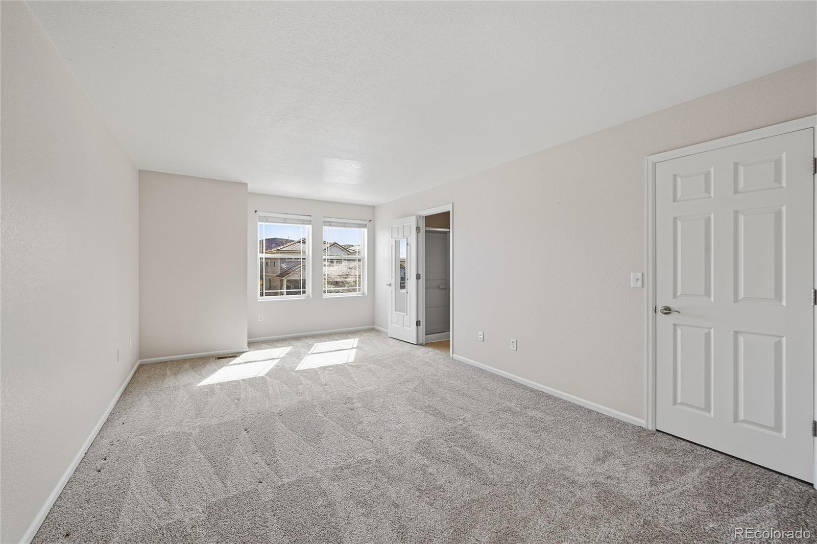 2075 Quartz Street Castle Rock, CO 80109 - Photo 16 of 25 a view of an empty room with a window