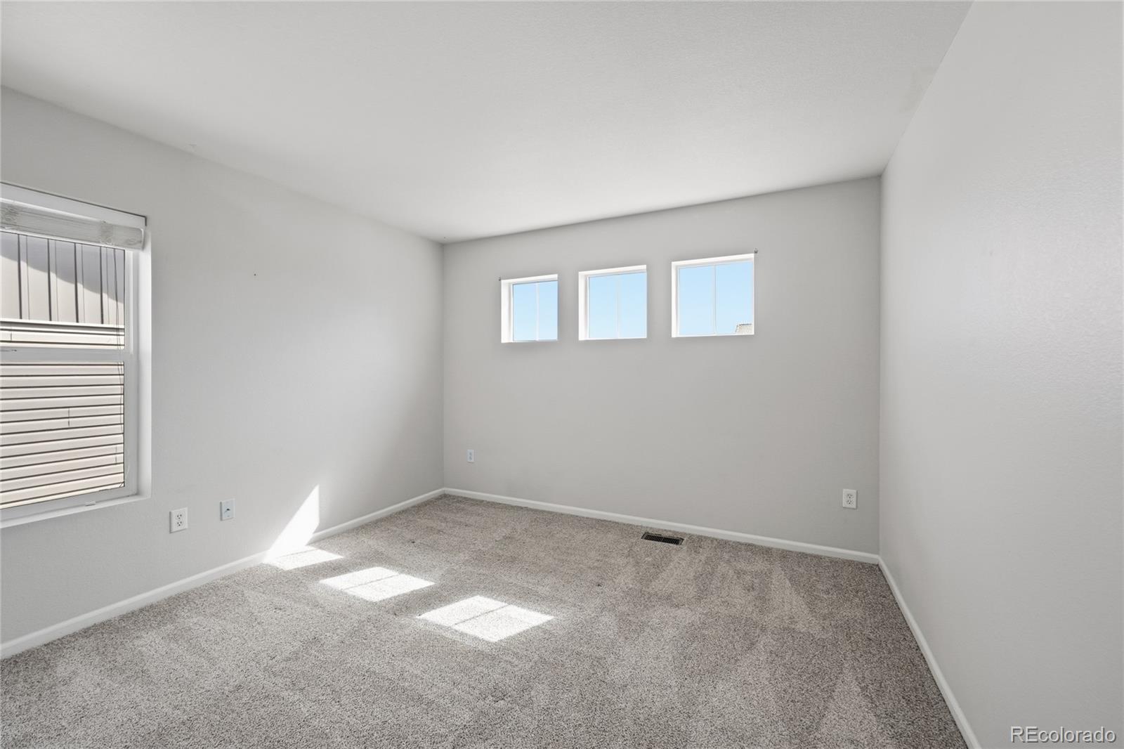 2075 Quartz Street Castle Rock, CO 80109 - Photo 22 of 25 an empty room with a window