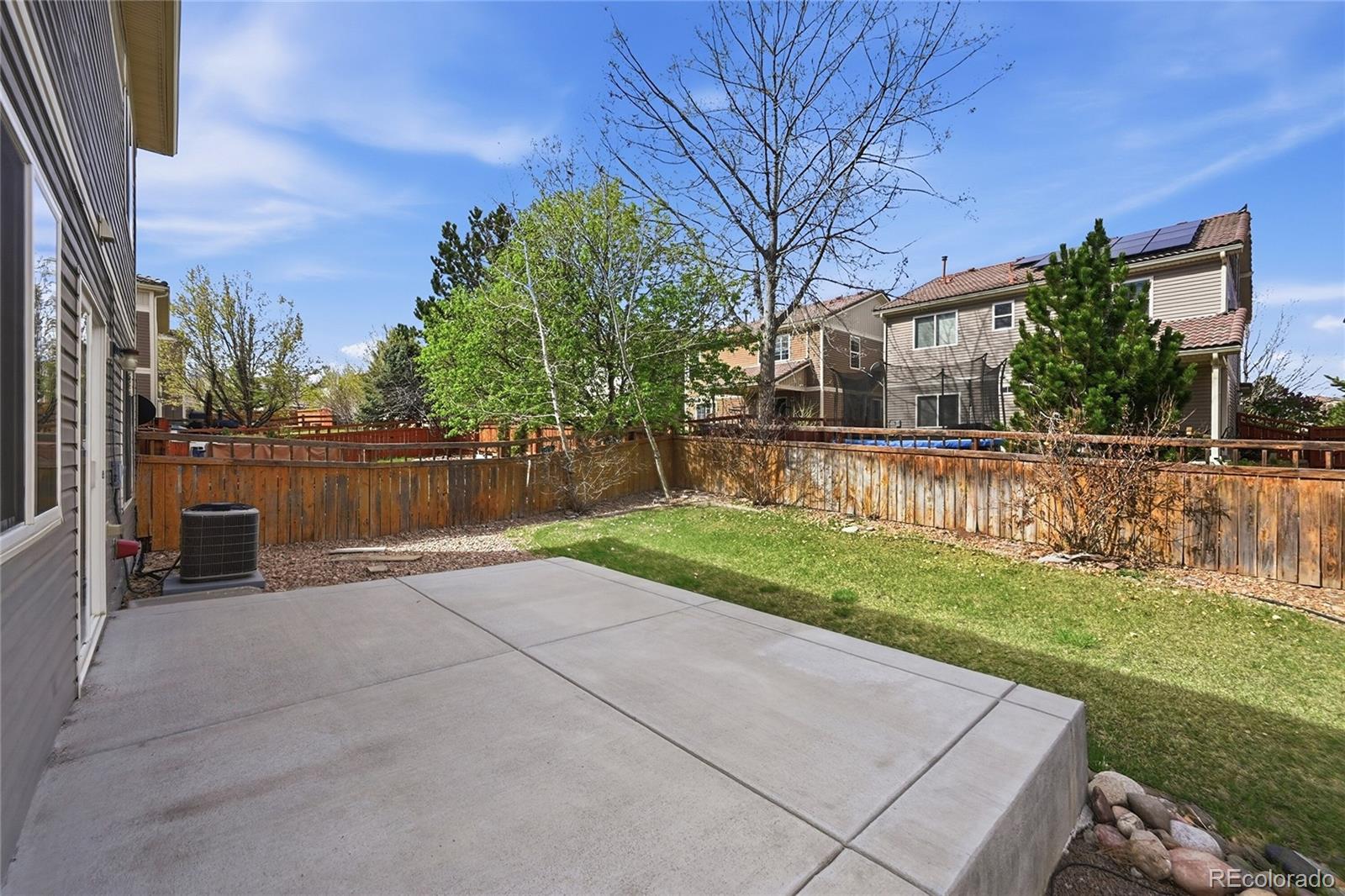 2075 Quartz Street Castle Rock, CO 80109 - Photo 24 of 25 a backyard of a house with lots of green space