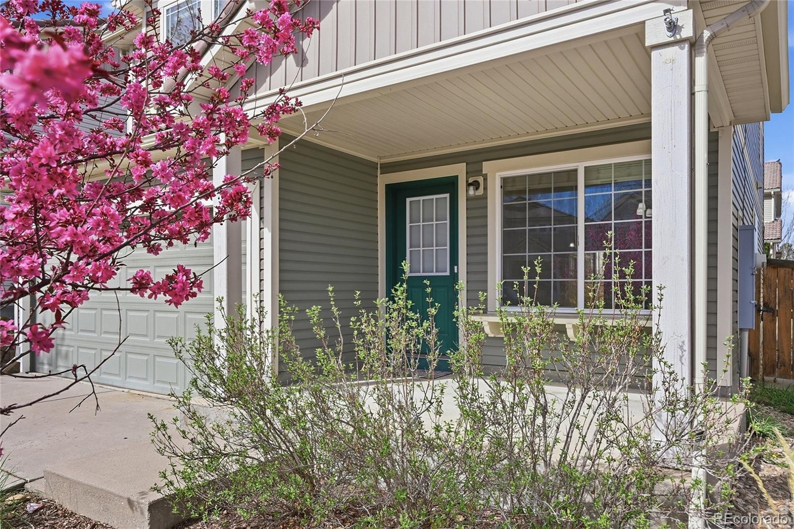 2075 Quartz Street Castle Rock, CO 80109 - Photo 3 of 25 a front view of a house with a yard