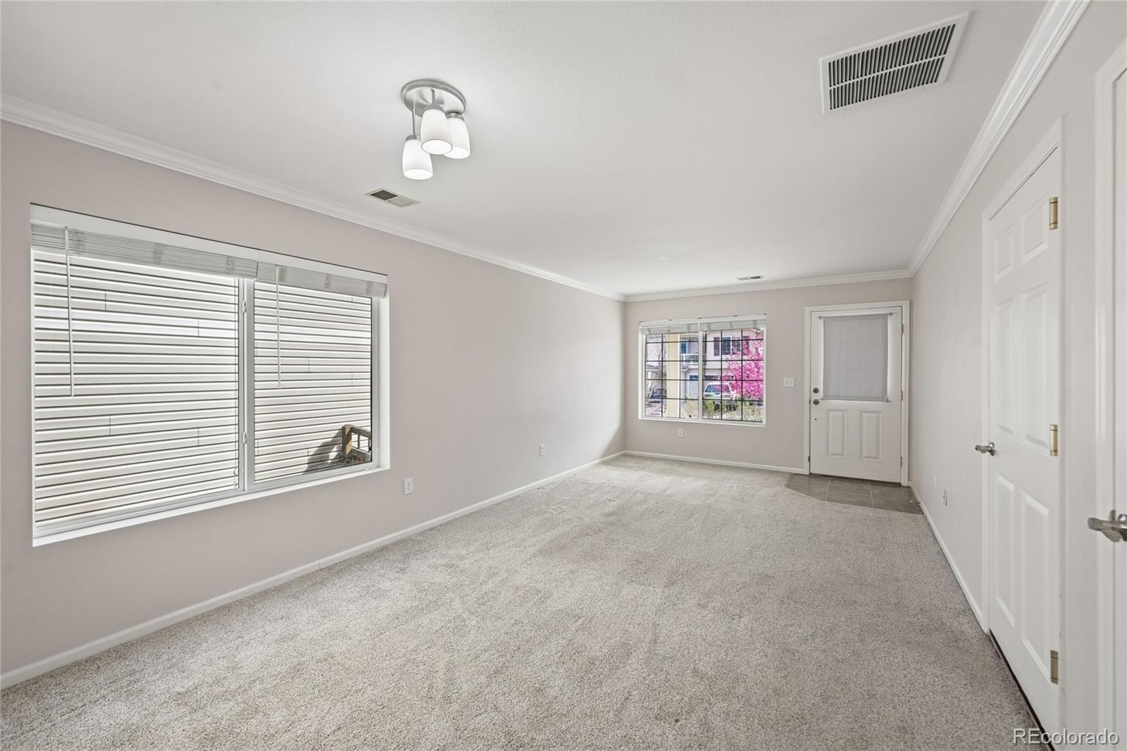 2075 Quartz Street Castle Rock, CO 80109 - Photo 7 of 25 a view of an empty room with a window
