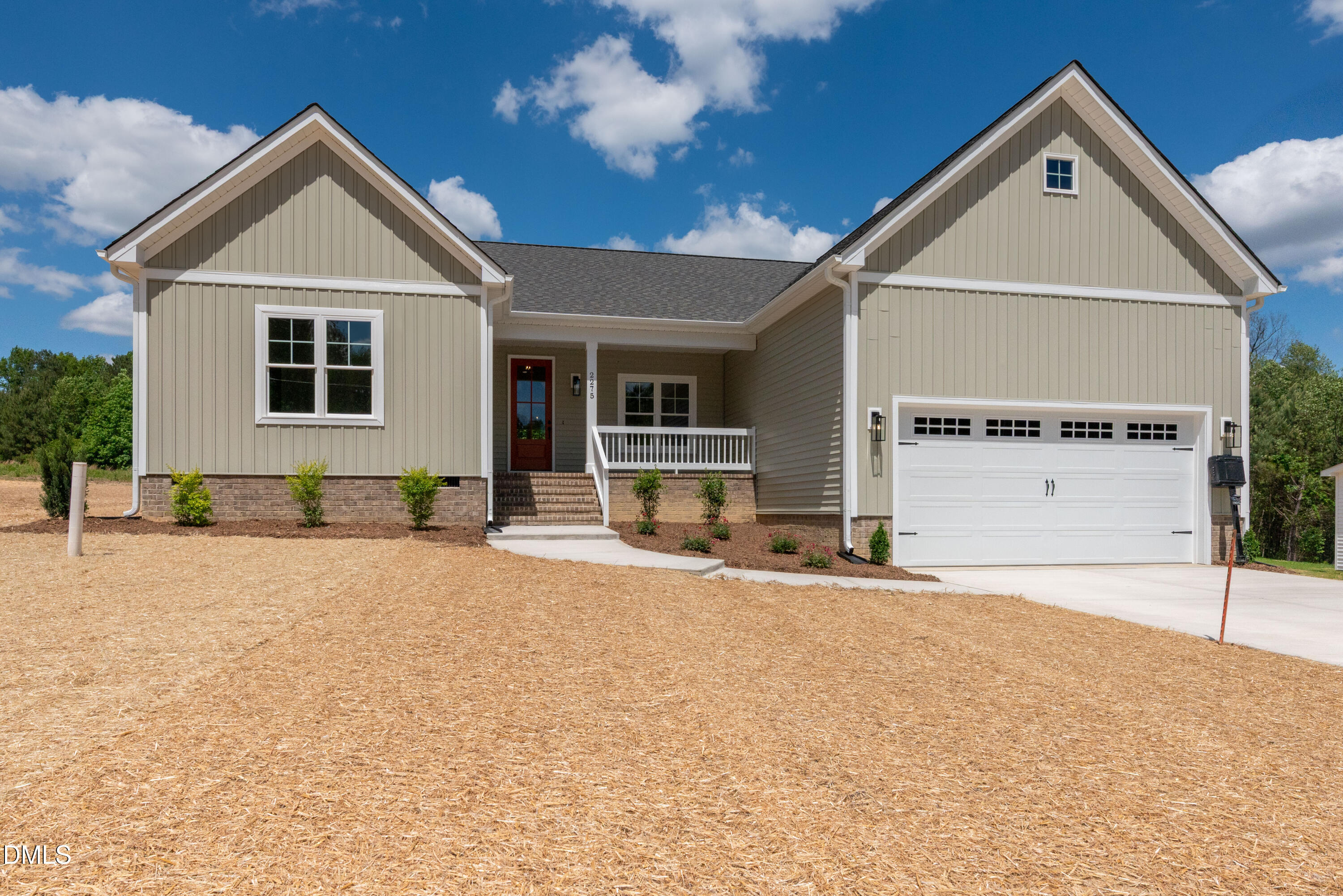 2275 Peachtree Hills Road Spring Hope, NC 27882 - Photo 42 of 43 a front view of a house with a yard and garage