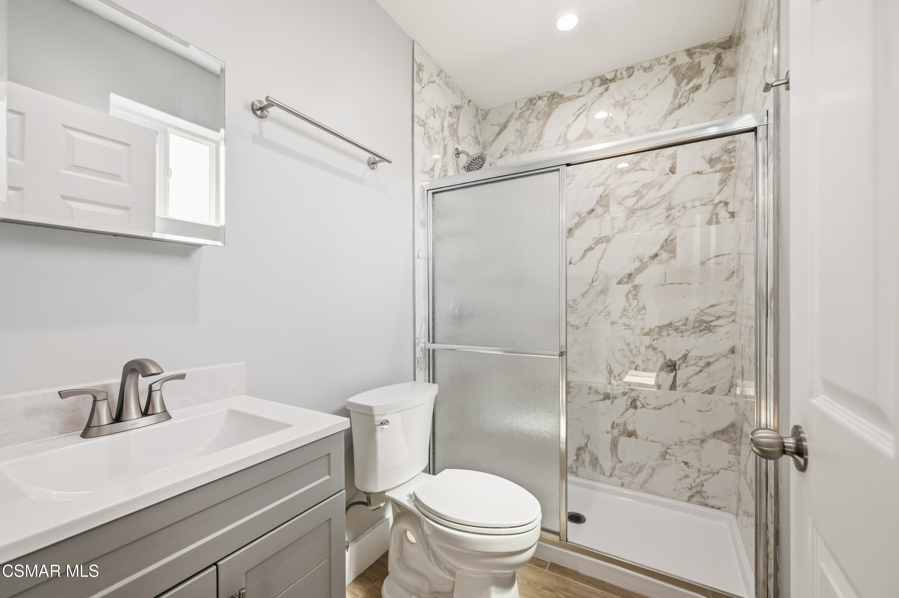 13102 Filmore Street Pacoima, CA 91331 - Photo 15 of 15 a bathroom with a sink a toilet and shower