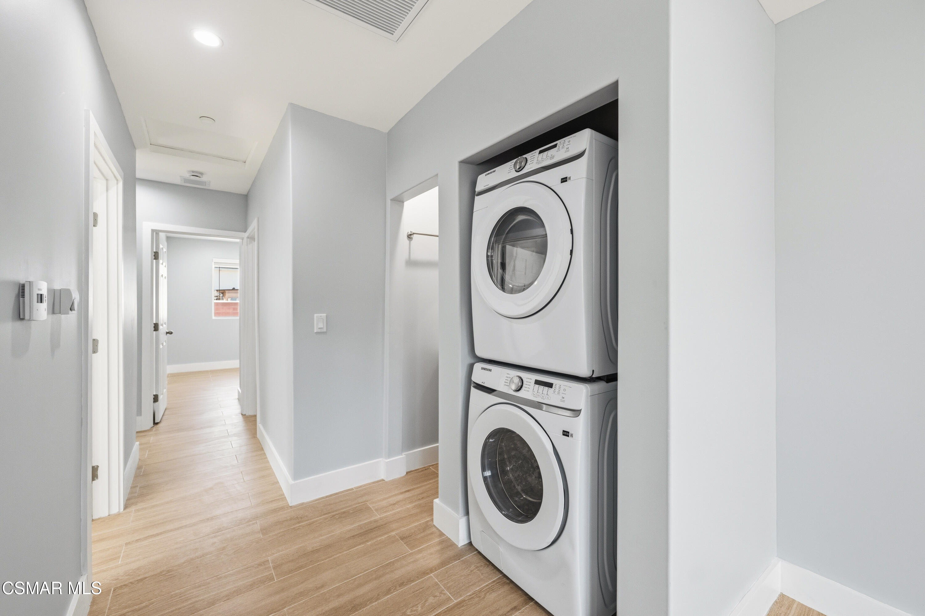 13102 Filmore Street Pacoima, CA 91331 - Photo 6 of 15 a view of a hallway with washer and dryer