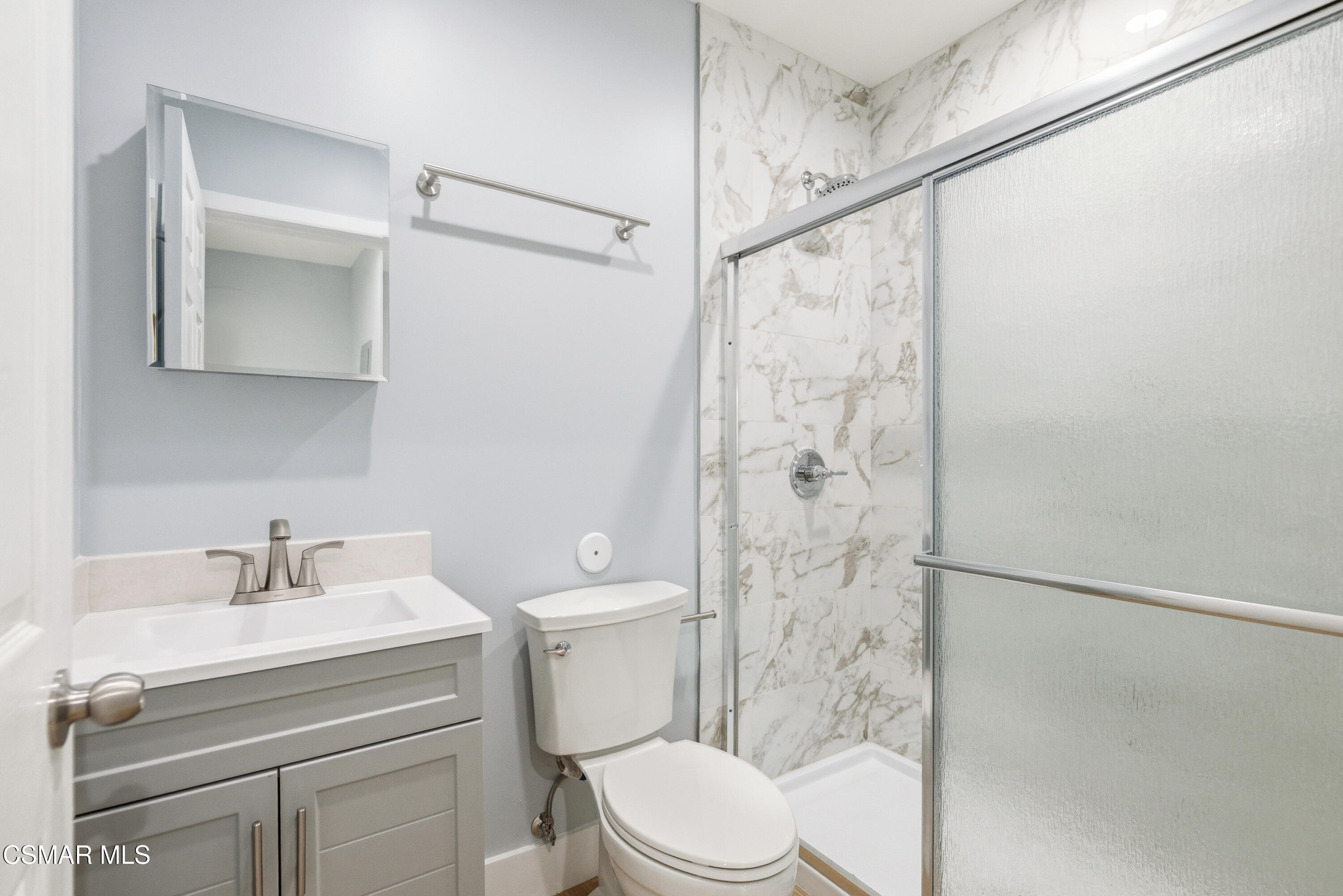 13102 Filmore Street Pacoima, CA 91331 - Photo 10 of 15 a bathroom with a sink a toilet and shower