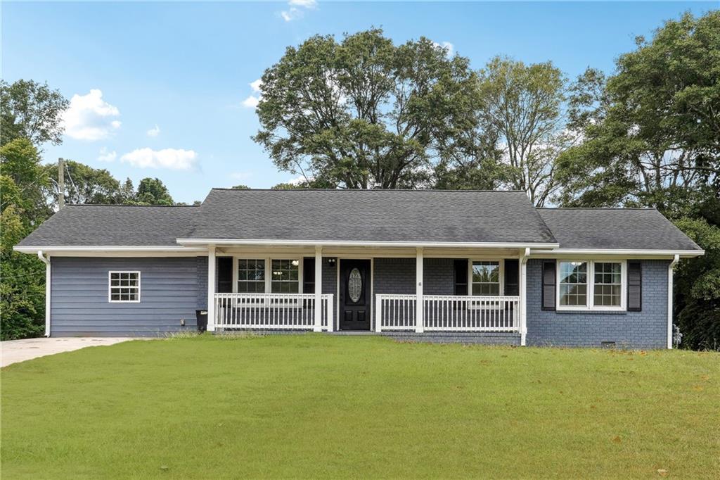 4399 East Paulding Drive Dallas, GA 30157 - Photo 1 of 1 front view of a house with a yard