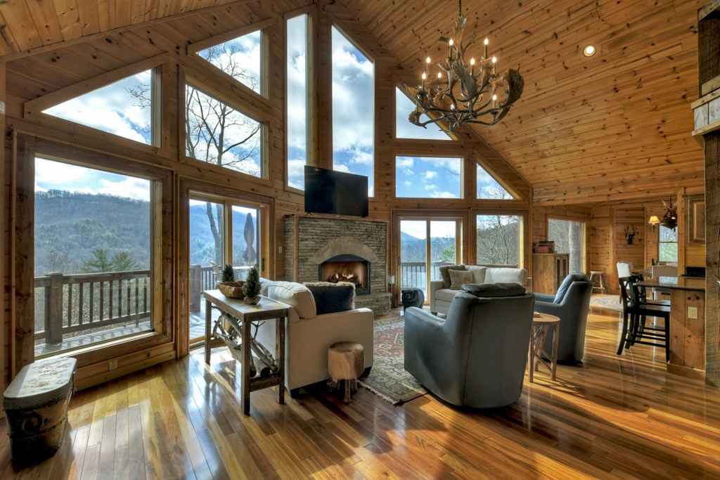 101 Falling Rock Road Cherry Log, GA 30522 - Photo 14 of 70 a living room with fireplace furniture and a large window