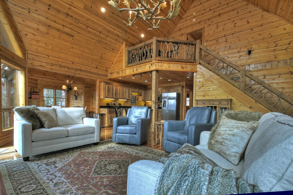 101 Falling Rock Road Cherry Log, GA 30522 - Photo 16 of 70 a living room with furniture and a chandelier