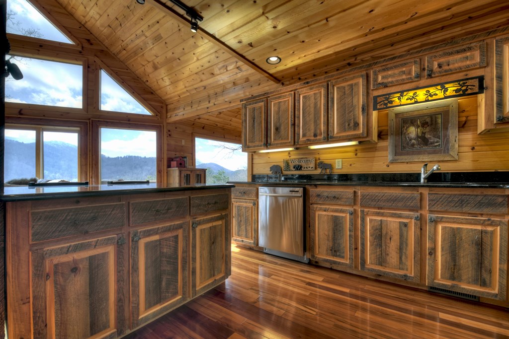 101 Falling Rock Road Cherry Log, GA 30522 - Photo 20 of 70 a kitchen with granite countertop a stove and cabinets