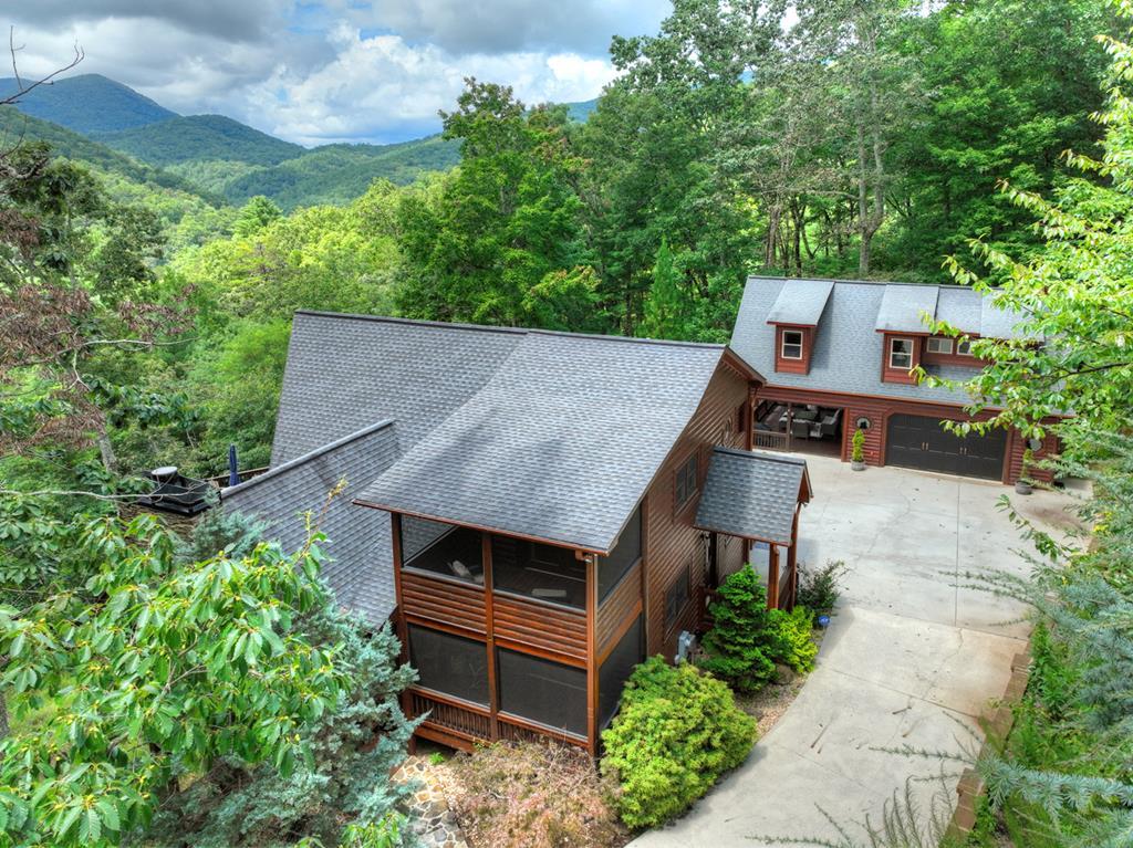 101 Falling Rock Road Cherry Log, GA 30522 - Photo 2 of 70 an aerial view of a house with a yard table and chairs