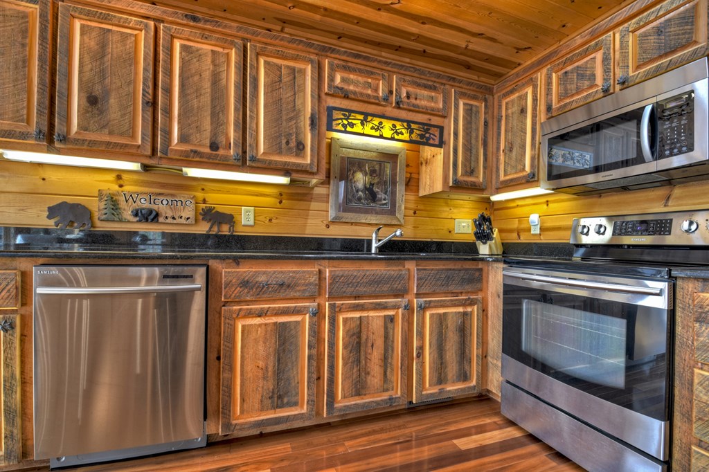101 Falling Rock Road Cherry Log, GA 30522 - Photo 21 of 70 a kitchen with stainless steel appliances granite countertop a stove and a microwave