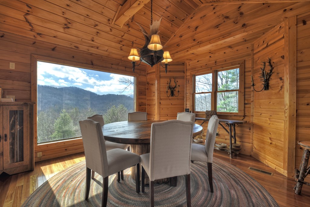 101 Falling Rock Road Cherry Log, GA 30522 - Photo 23 of 70 a view of a dining room with furniture wooden floor and chandelier