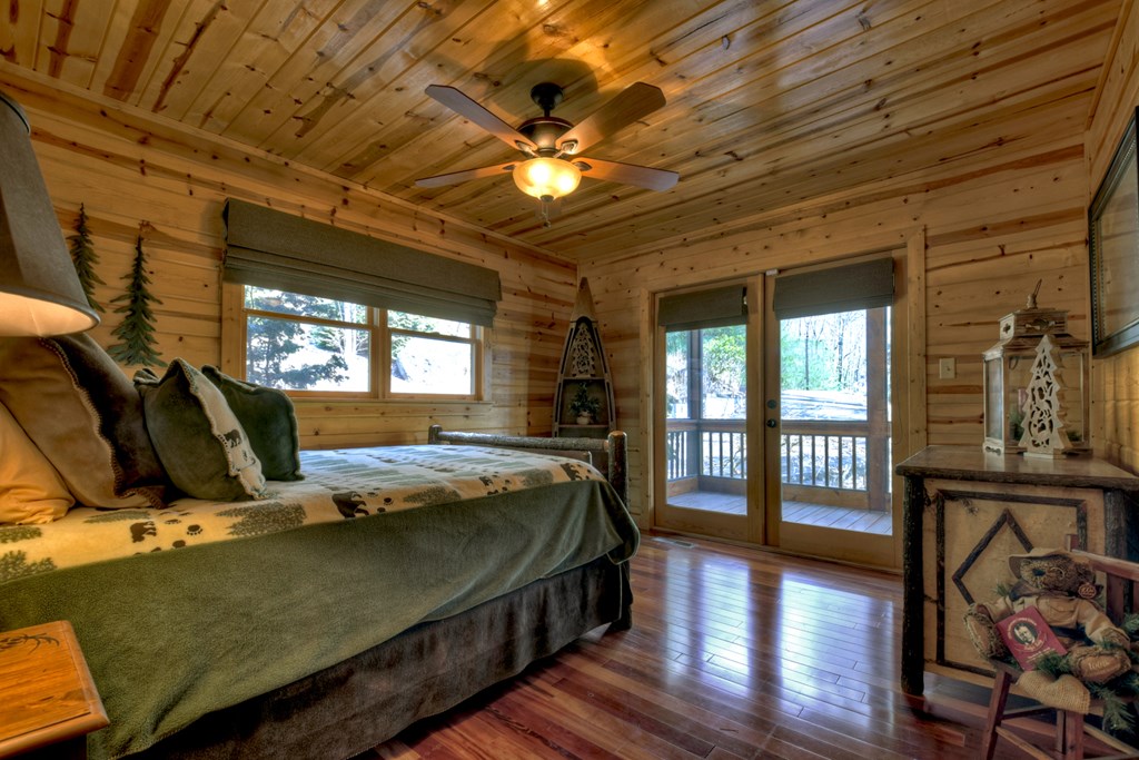 101 Falling Rock Road Cherry Log, GA 30522 - Photo 24 of 70 a bed room with a bed and wooden floor
