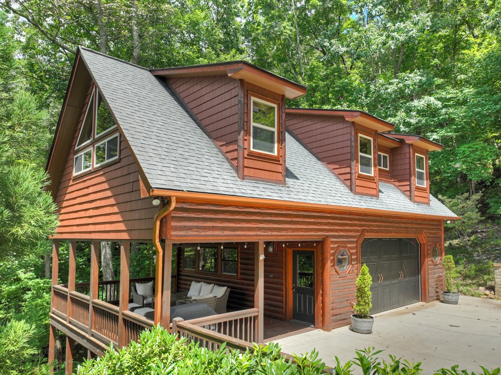101 Falling Rock Road Cherry Log, GA 30522 - Photo 3 of 70 a front view of a house with garden