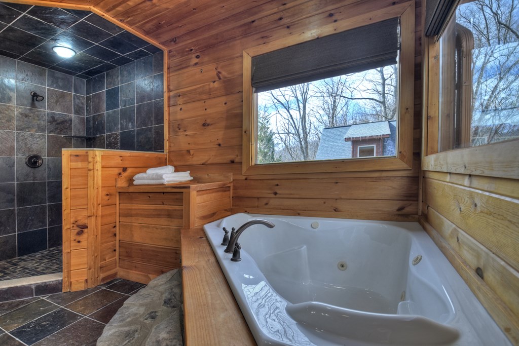 101 Falling Rock Road Cherry Log, GA 30522 - Photo 32 of 70 a bathroom with a tub and shower