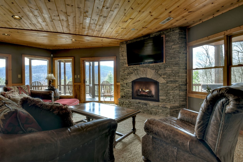 101 Falling Rock Road Cherry Log, GA 30522 - Photo 33 of 70 a living room with furniture and a fireplace