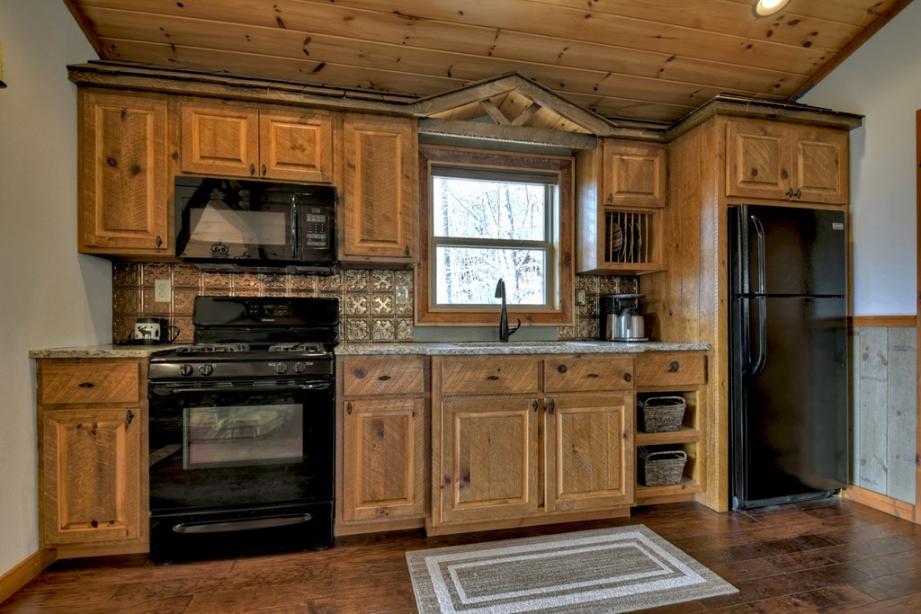 101 Falling Rock Road Cherry Log, GA 30522 - Photo 41 of 70 a kitchen with stainless steel appliances granite countertop a stove and a microwave