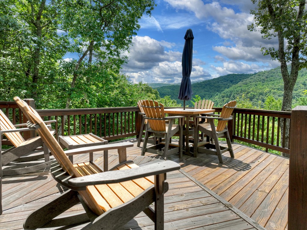 101 Falling Rock Road Cherry Log, GA 30522 - Photo 70 of 70 a view of a balcony with chairs and wooden floor