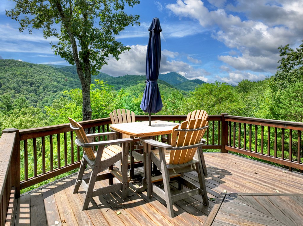 101 Falling Rock Road Cherry Log, GA 30522 - Photo 9 of 70 a view of a balcony with a table and chairs