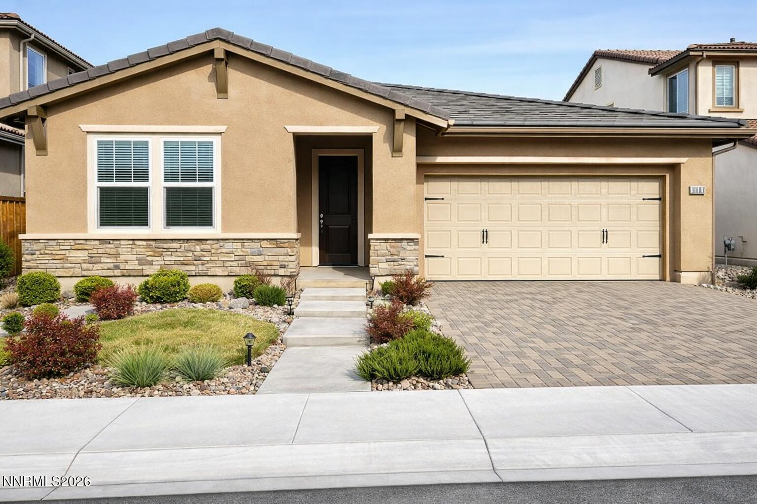 1987 Wind Walker Drive Reno, NV 89521 - Photo 1 of 16 a front view of a house with garage