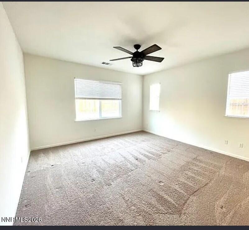 1987 Wind Walker Drive Reno, NV 89521 - Photo 5 of 16 a view of a big room with wooden floor and windows