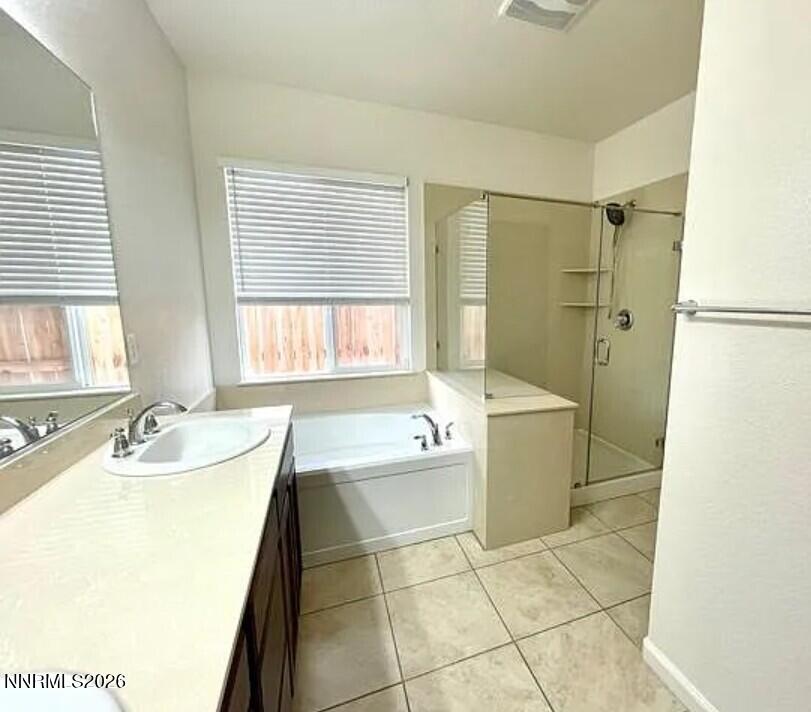 1987 Wind Walker Drive Reno, NV 89521 - Photo 7 of 16 a bathroom with a tub sink and mirror