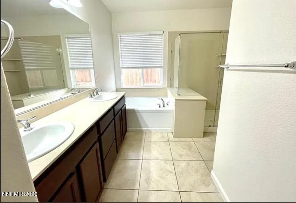 1987 Wind Walker Drive Reno, NV 89521 - Photo 8 of 16 a bathroom with a tub sink and mirror